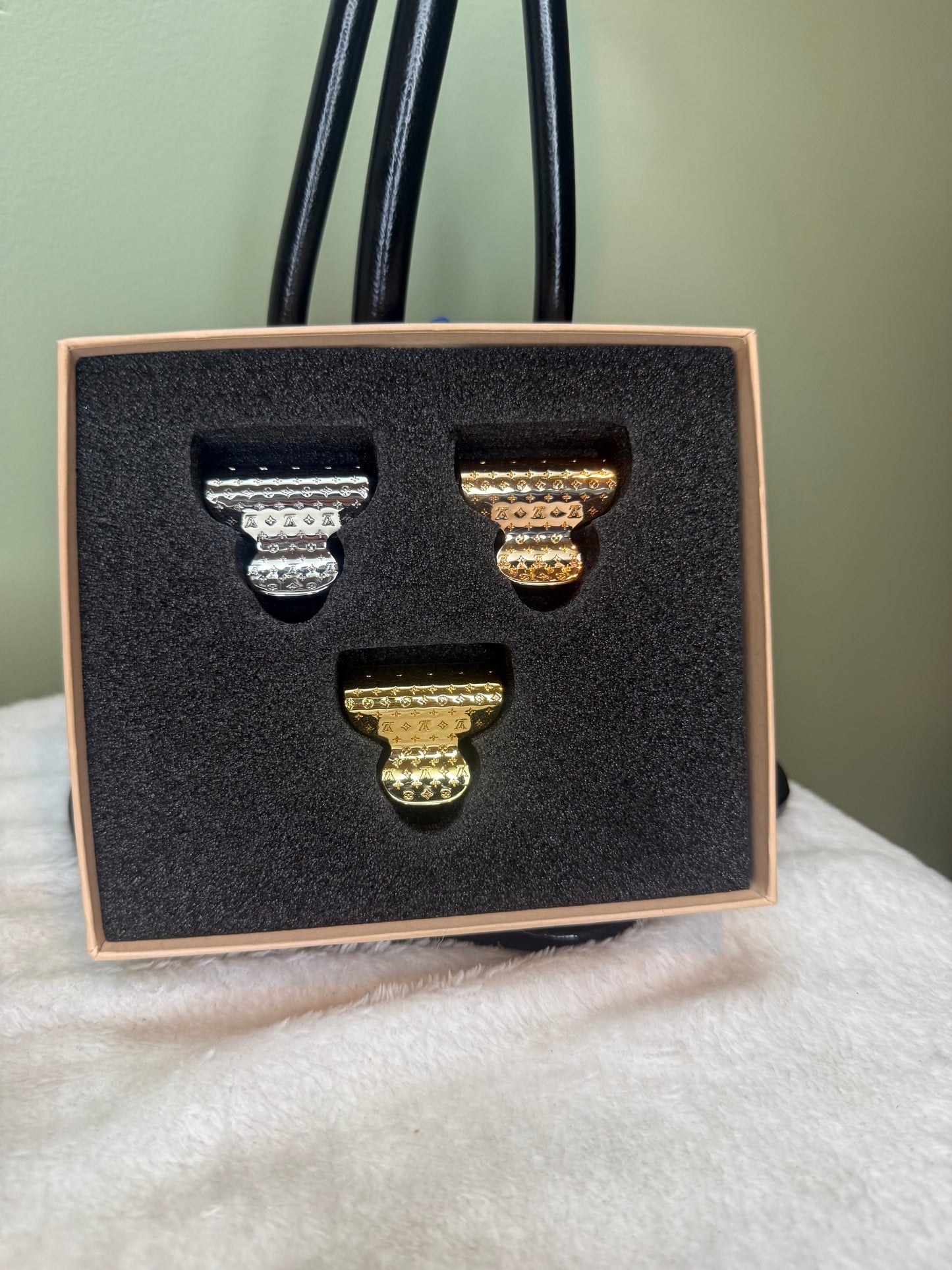 1250. Louis Vuitton Nanogram Set of 3 Hair clips