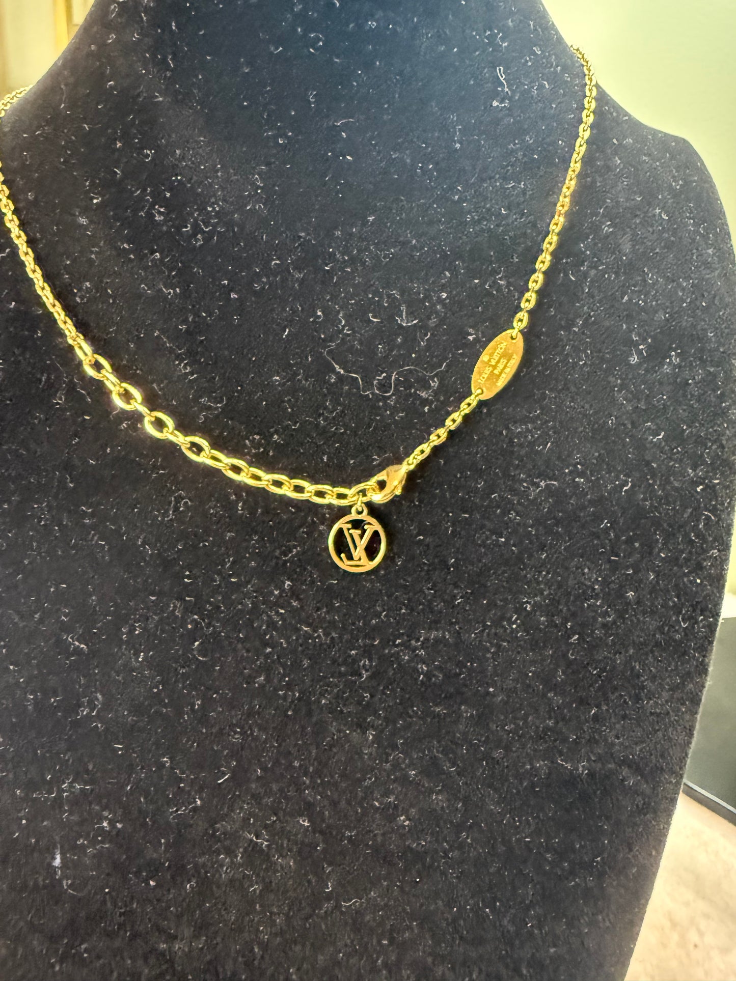 1235. Louis Vuitton Rhinestone LockIt Pendant