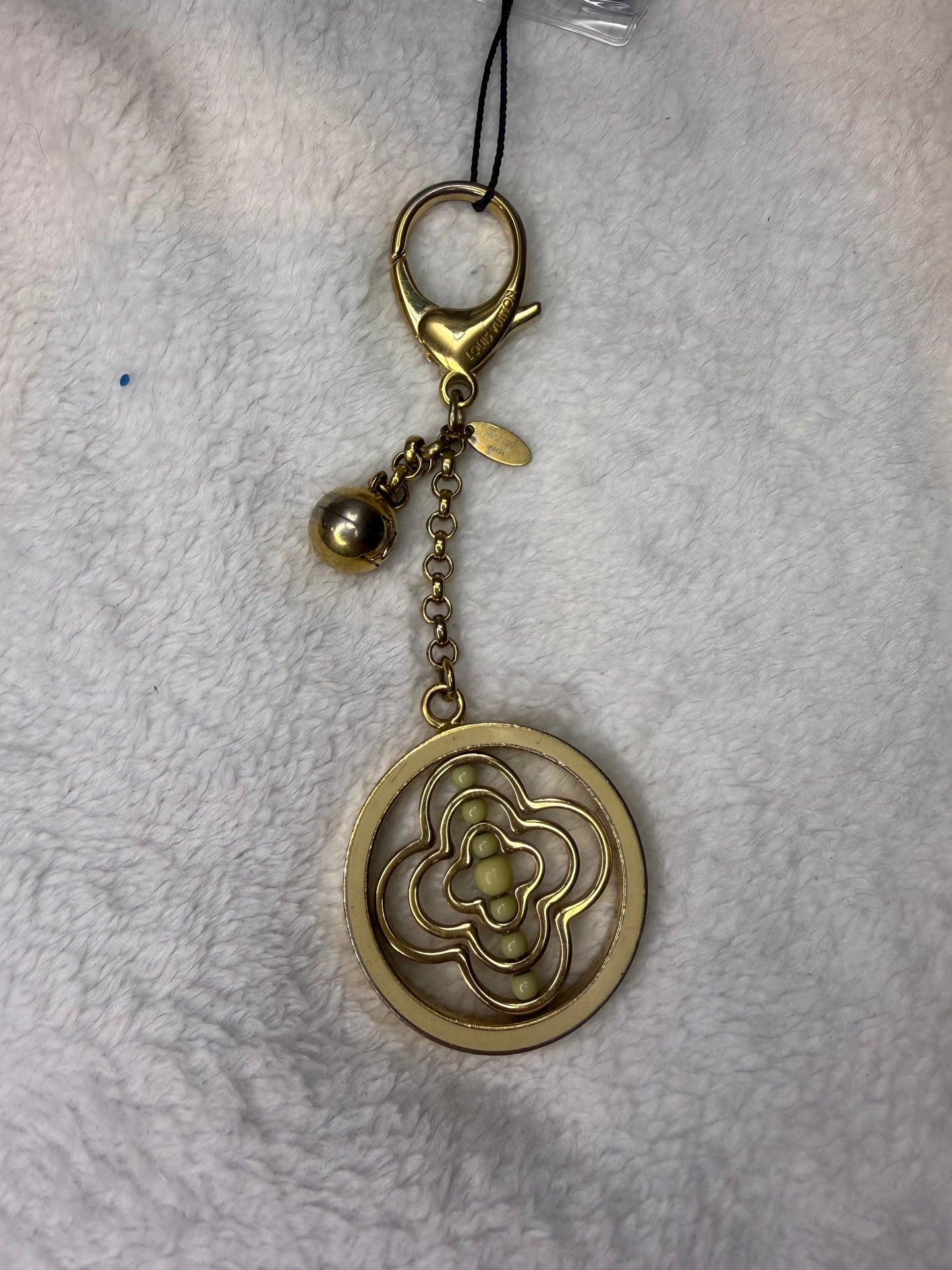 1442. Louis Vuitton Gold Whirly Flower Bag Charm