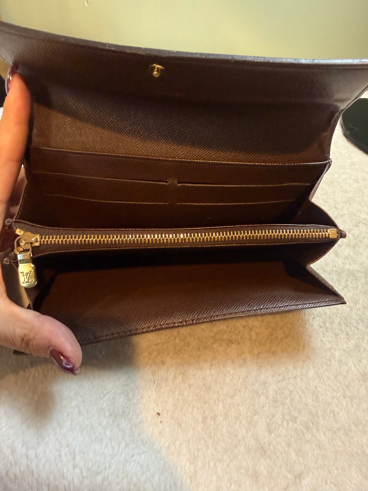 1680. Louis Vuitton Damier Ebene Sarah Wallet