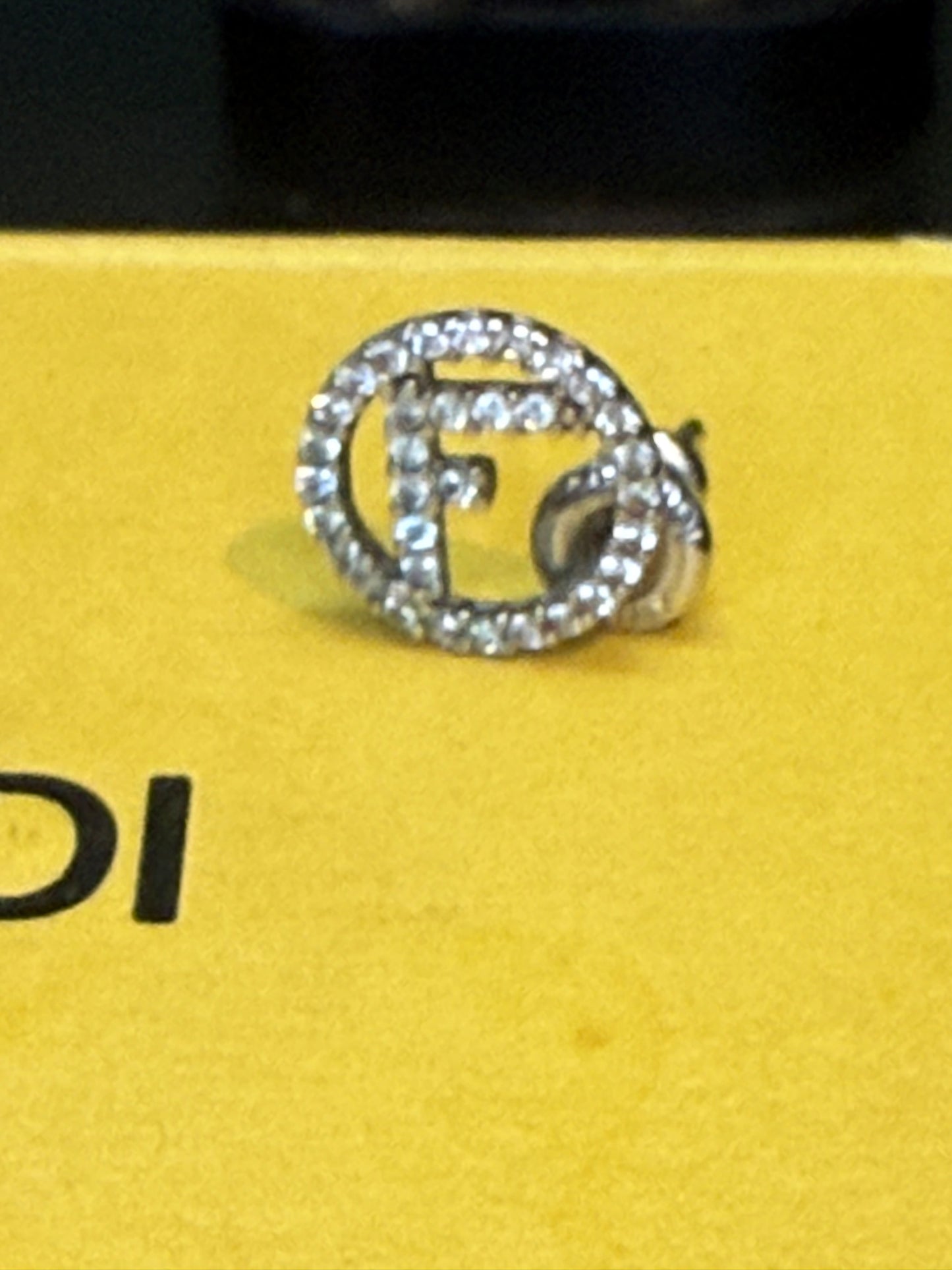 1747. Fendi Silver F Logo earrings with micro Crystals