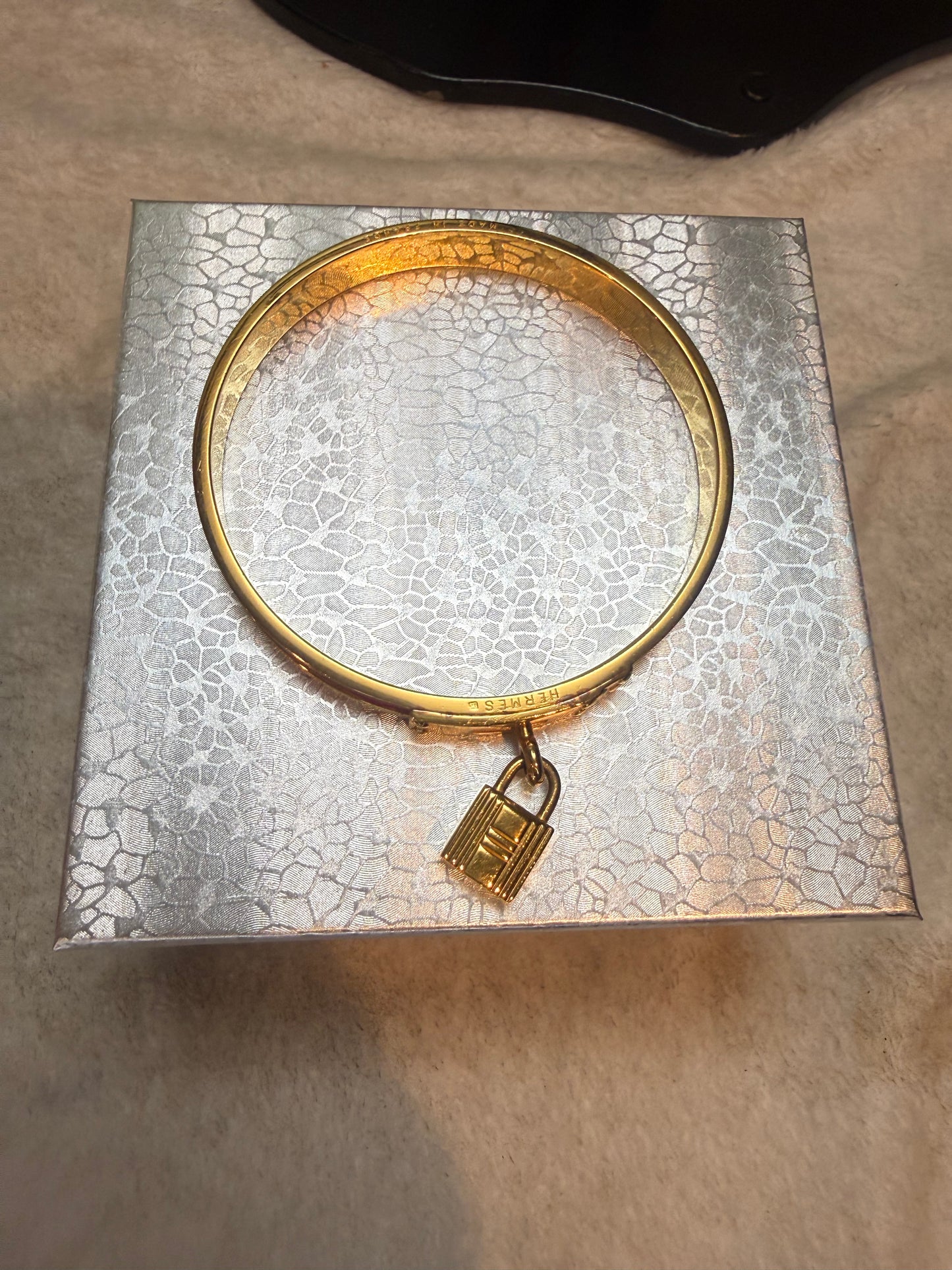 1694. Hermes Kelly Cadena Lock Bangle in Red Lizard embossed Leather
