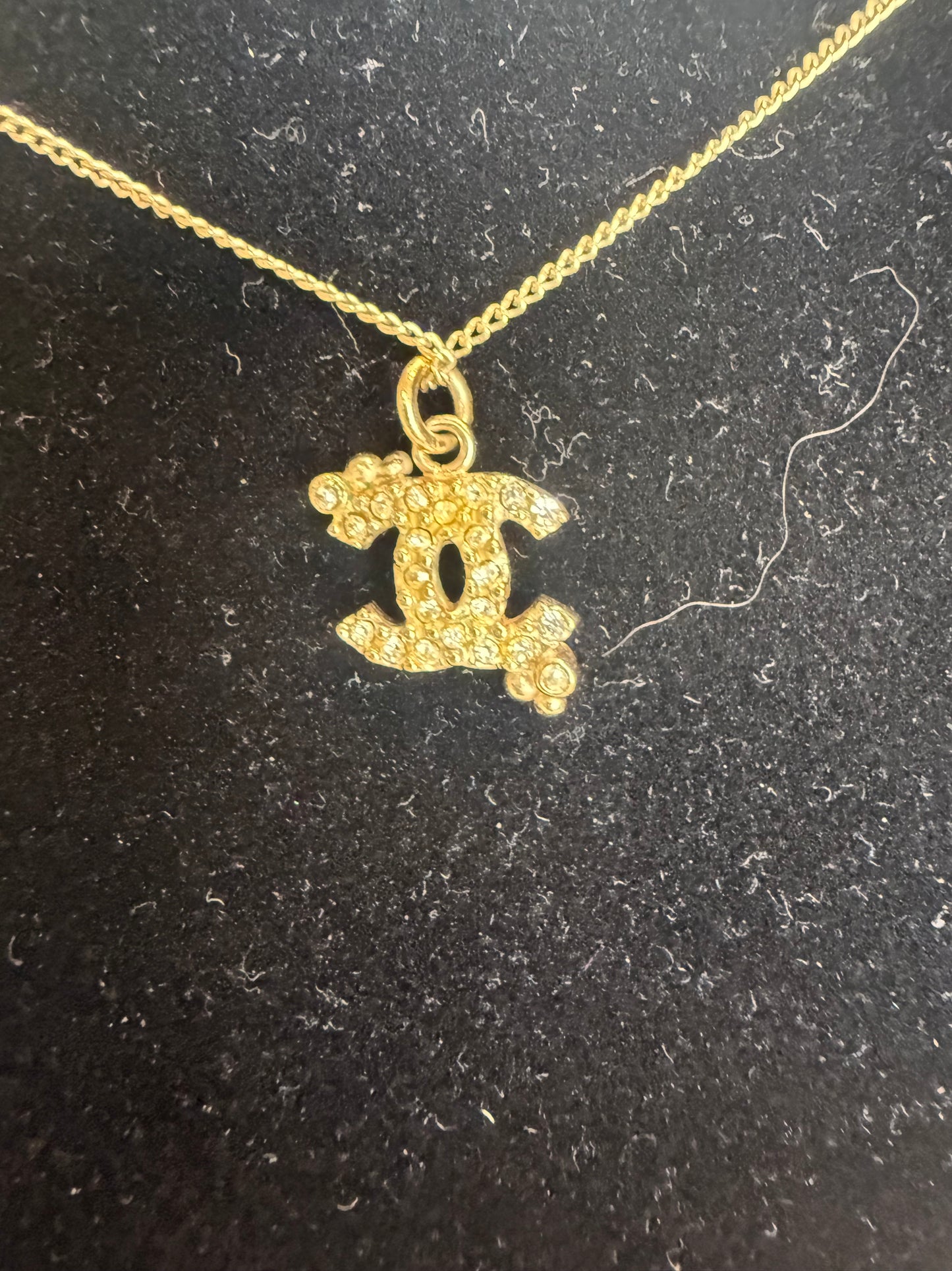 1306. Chanel Gold Toned small Crystal Encrusted Interlocking CC necklace