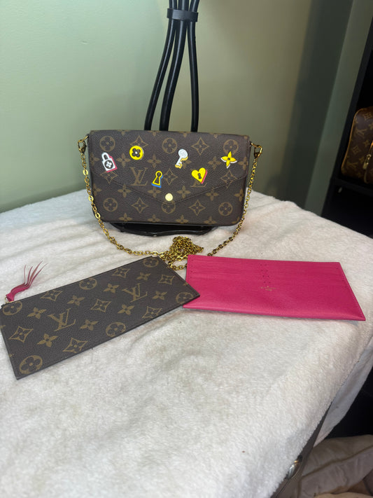 1161. Louis Vuitton Limited Edition Monogram Love Lock Felicie Pochette