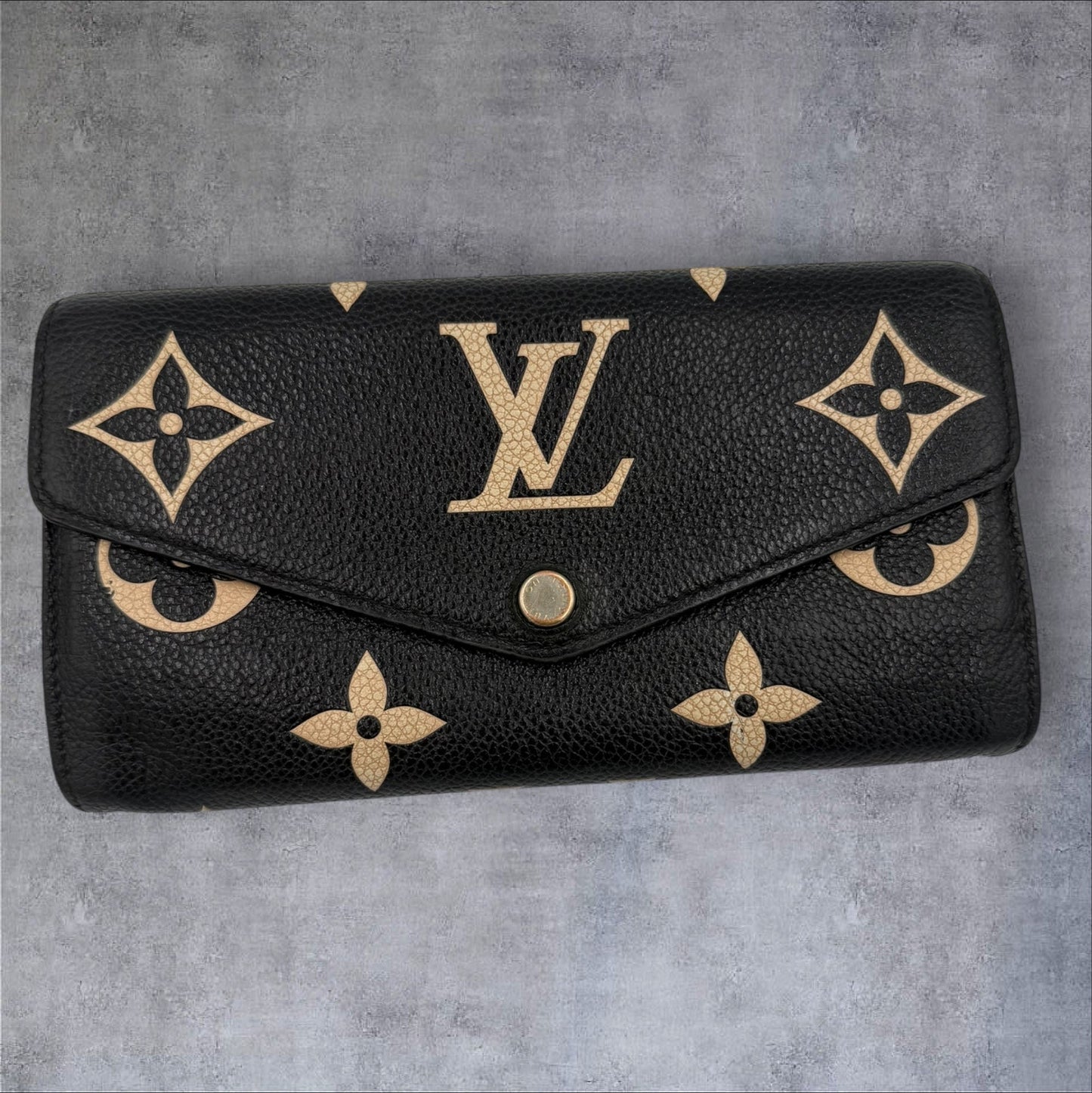400. Louis Vuitton Bicolor Monogram Empriente Sarah Wallet