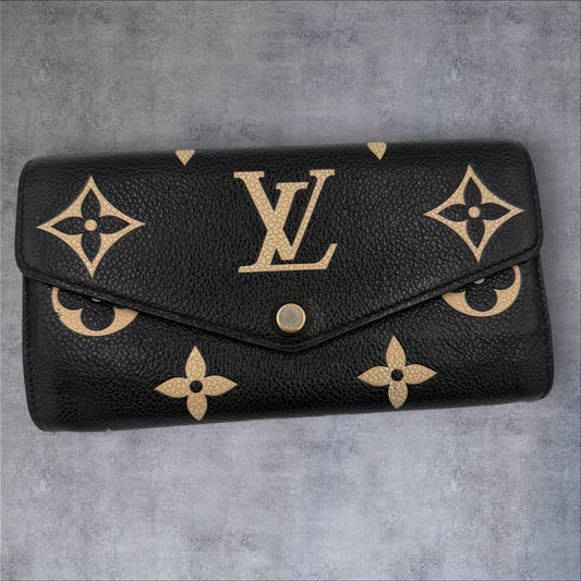 400. Louis Vuitton Bicolor Monogram Empriente Sarah Wallet