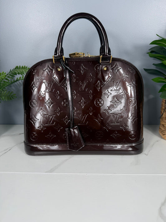 2218. Louis Vuitton Amarante Vernis Alma PM