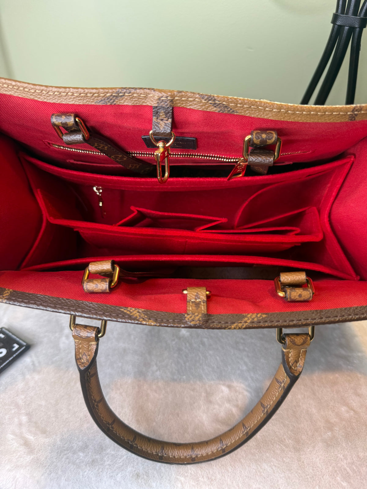 2180. Louis Vuitton Reverse Monogram OnTheGo MM