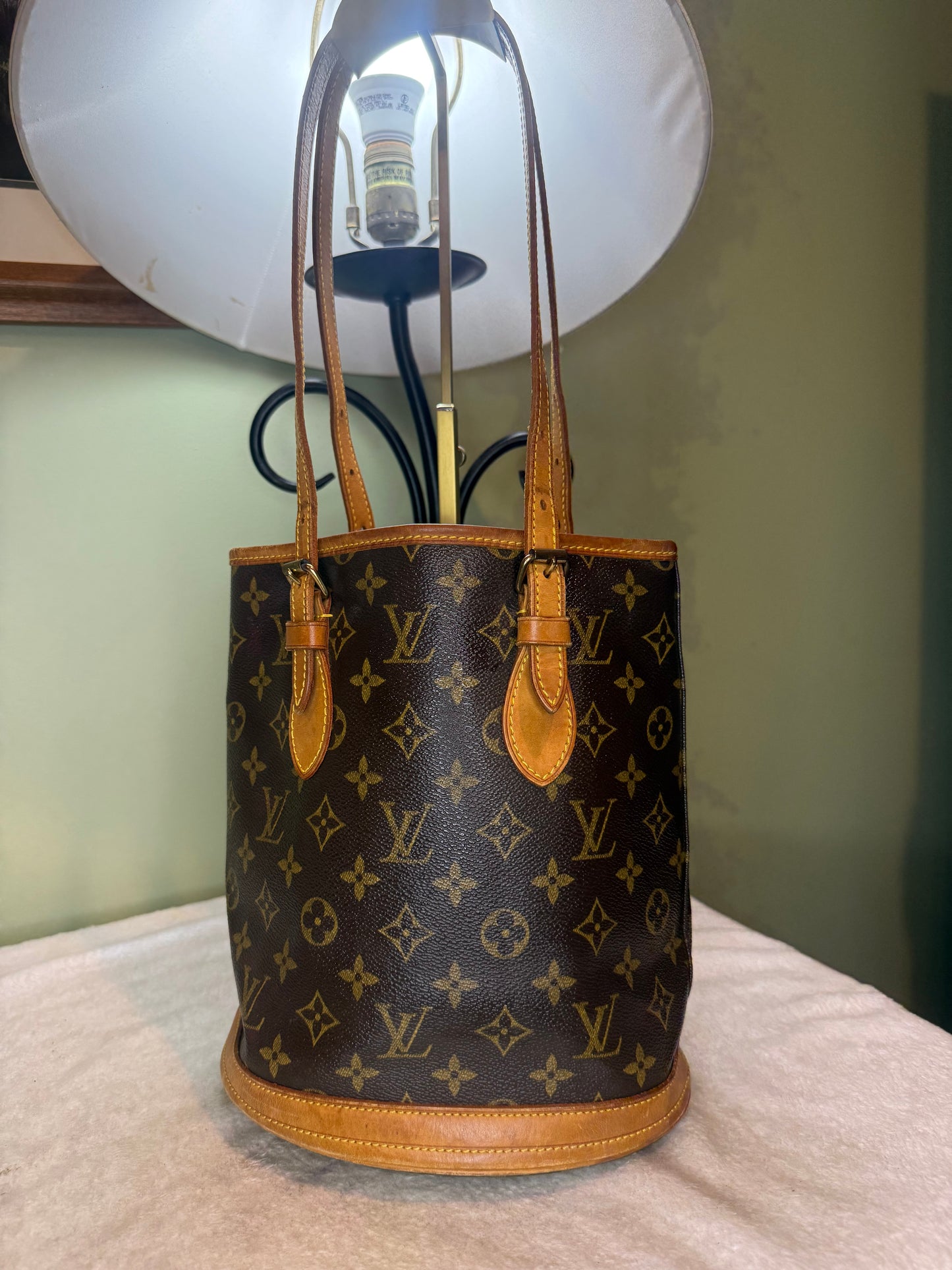 1469. Louis Vuitton Monogram Petit Bucket Bag