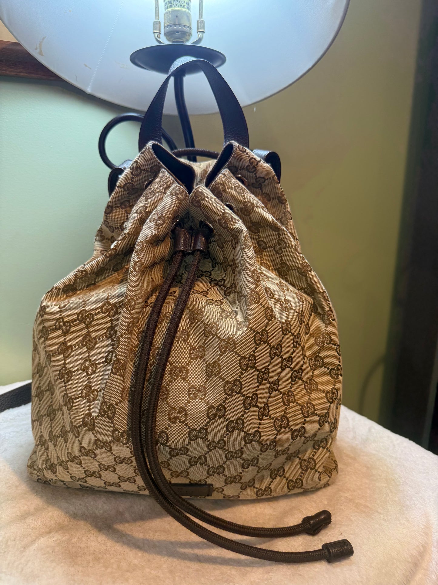 1679. Gucci GG Supreme Canvas Drawstring Backpack