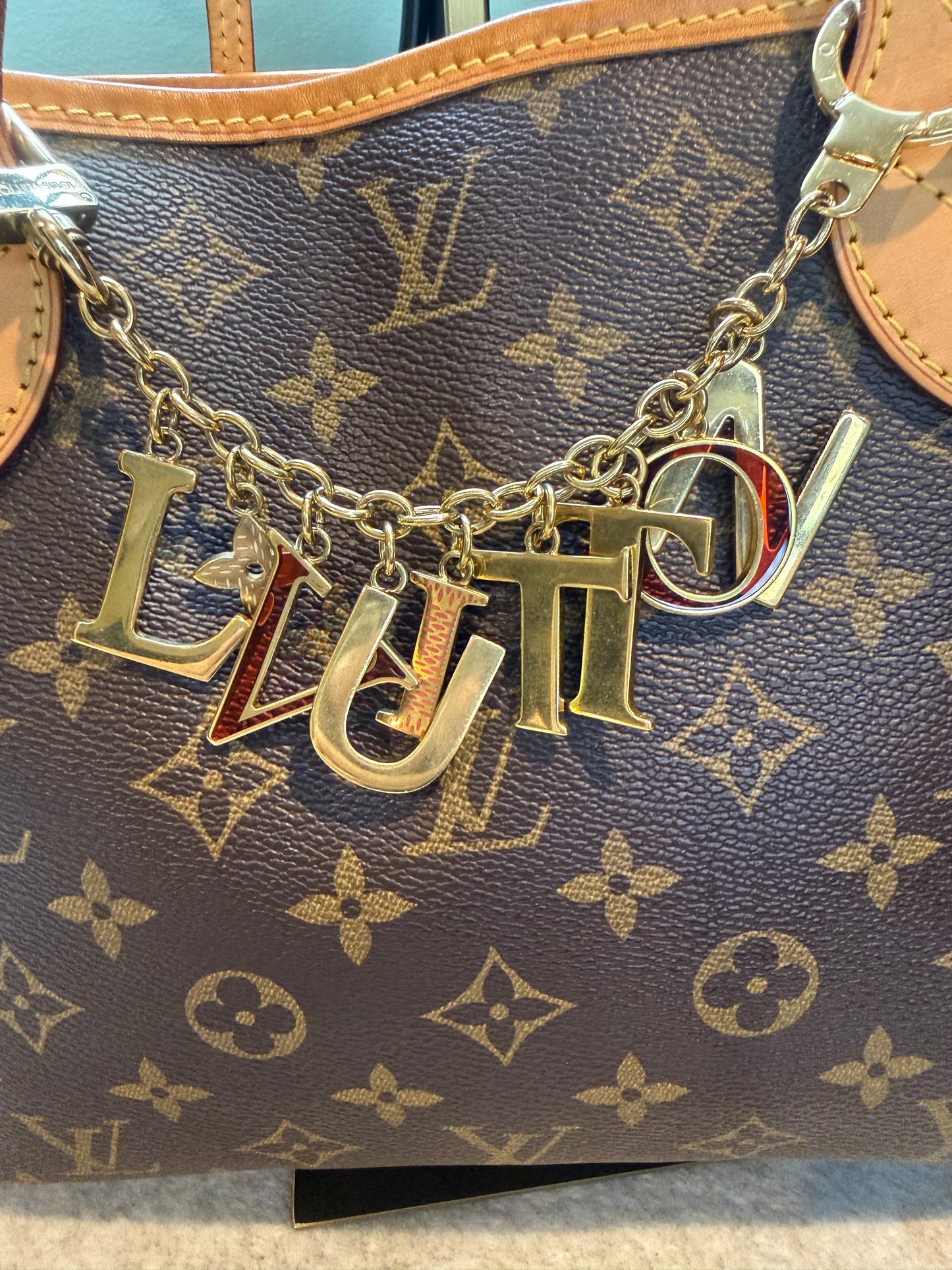 1609. Louis Vuitton Limited Edition "L Vuitton" Charm