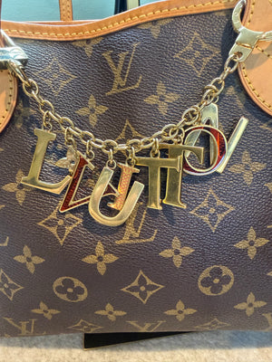 1609. Louis Vuitton Limited Edition "L Vuitton" Charm