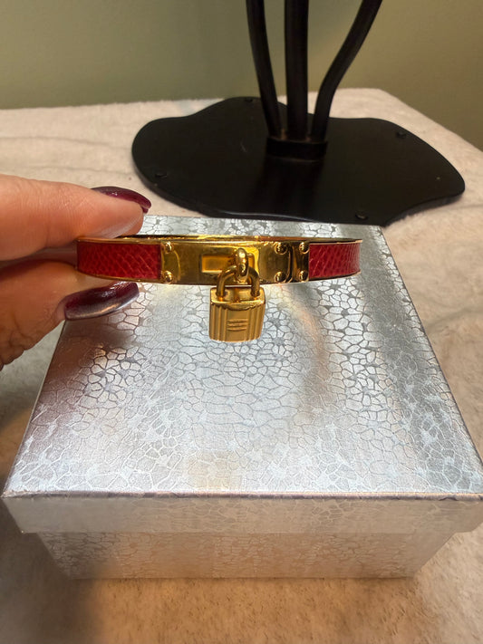 1694. Hermes Kelly Cadena Lock Bangle in Red Lizard embossed Leather