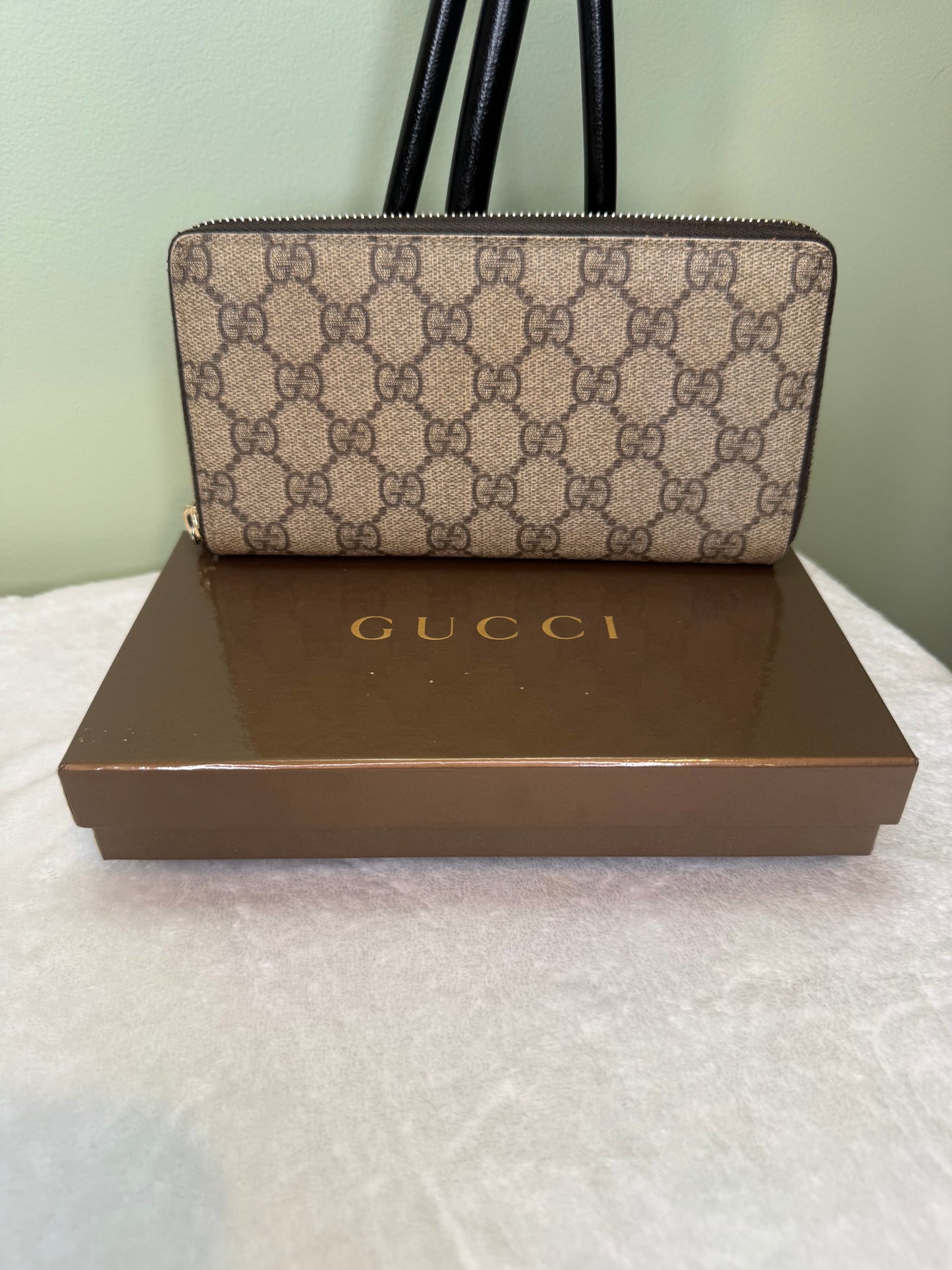 1787. Gucci GG Supreme Canvas Zippy Wallet