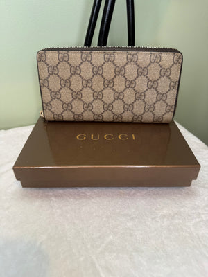 1787. Gucci GG Supreme Canvas Zippy Wallet