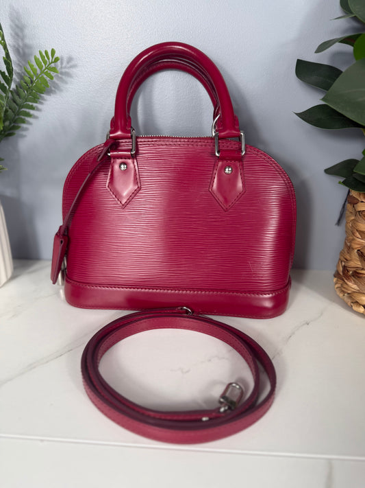 2249. Louis Vuitton Raspberry Epi Alma BB